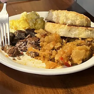 Scrambled eggs, sausage, hashbrowns and biscuit.