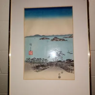 oriental Scenery of the ocean boats mountains and trees