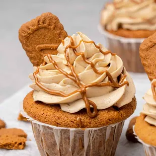 a cupcake with frosting and cookies