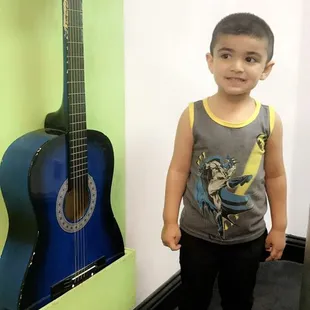 Downstairs music room has 3 guitars and a piano