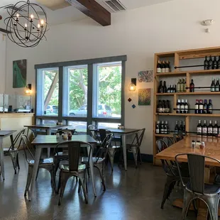 a dining area with tables and chairs
