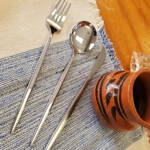 a table setting with utensils
