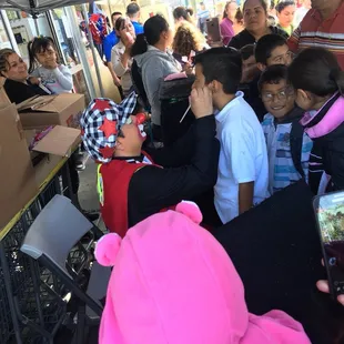 a group of children in a tent