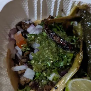 a taco in a styrofoam container