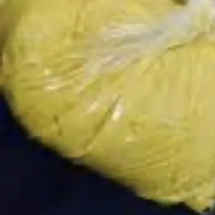 a banana wrapped in a plastic bag