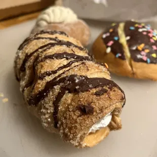 a doughnut with chocolate icing and sprinkles