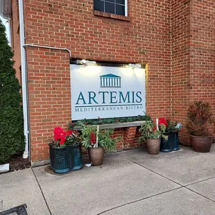 the entrance to artemis mediterranean bistro