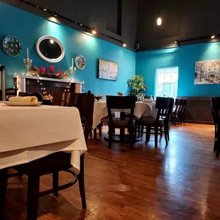 a dining room with blue walls