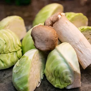 a pile of vegetables on a cutting board