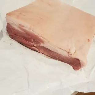 a piece of meat on a piece of paper