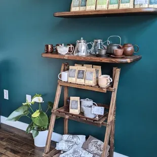 a shelf of teas and plants