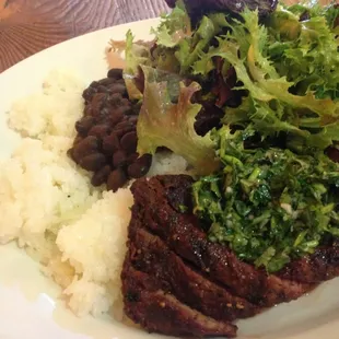 Grilled flat iron steak with salad rice and Blk beans