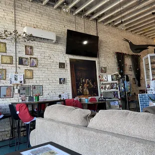 a living room with exposed ceilings