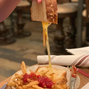 a plate of french fries and a sandwich