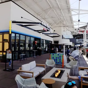 Outdoor terrace with heaters, fire pits and games.