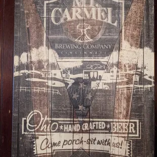 Local marketing on wall.  There are these sign for almost all local brews here.
