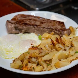New York steak, and eggs and potatoes.