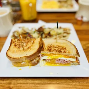 Breakfast Sandwich with ham and eggs sunny side up.