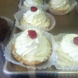 cupcakes with whipped cream and cherries