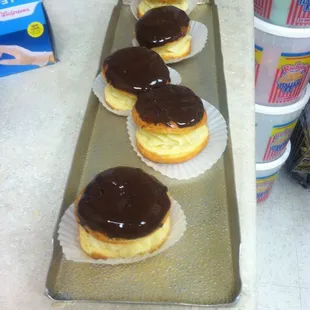 a row of chocolate covered donuts