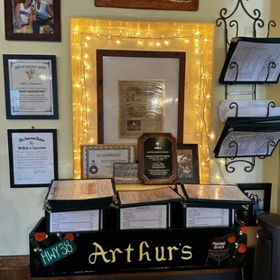 Wall with awards given to Arthurs Restaurant.