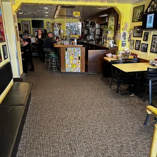 The entrance to Arthurs. Bar area and a couple tables straight ahead. Left side of picture is main dining room, back patio is past bar area.