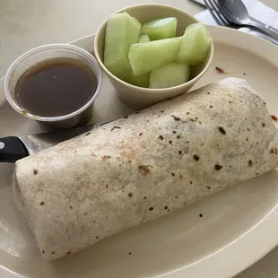 bacon burrito with a side of fruits