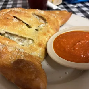 El Salvador Calzone (Red sauce base, beef, &amp; mozzarella, chicken, cheddar cheese, &amp; jalapeño.) $16.95 (1/13/2024)