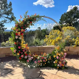 Colorful wedding floral arch at the Four Seasons, Santa Fe.