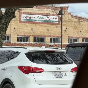 cars parked in front of a building