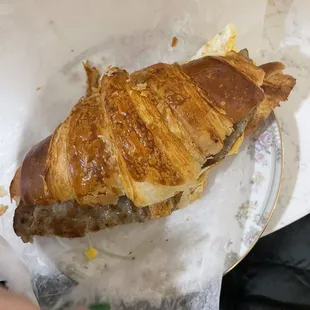 Sausage, egg, and cheese on a croissant