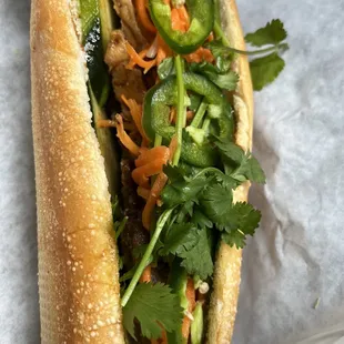 Banh mi - grilled pork on one half and tofu on the other half