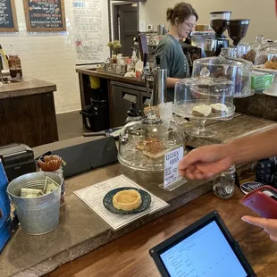 a woman working at a coffee shop