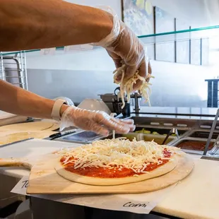 a person making a pizza