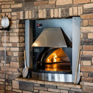 a brick wall with a pizza oven