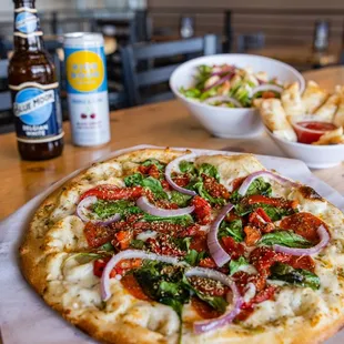 a plate of food and a bottle of beer