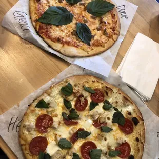Top: Graciela pizza Bottom: custom pizza with Waite garlic sauce, mozzarella, chicken, pepperoni and basil