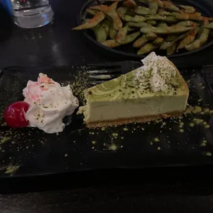 spicy edema background appetizer rear w/delicious Macha delicious cheese cake desert  in foreground.