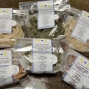 We carry Nicole Taylor's Pasta, spinach, pici, lemon pepper, parmesan chive, spicy red pepper, linguine, spaghettini, and tomato basil.