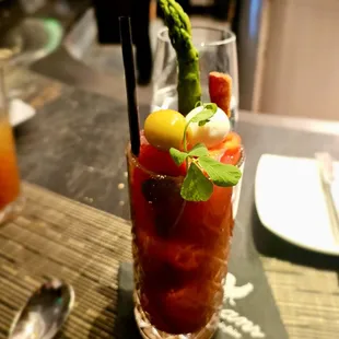 Brunch Bloody Mary (quail egg, olive, slice of bacon, whole red pepper, asparagus spear)