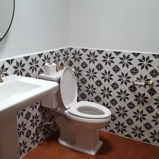 a bathroom with a toilet and sink