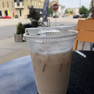 a cup of iced coffee on a table