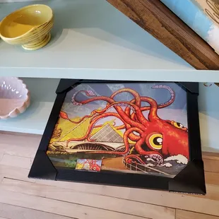 a painting of an octopus on a shelf