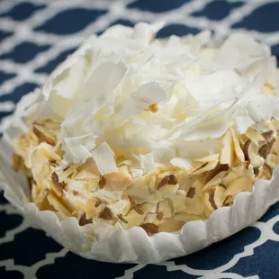 Almond Success with white chocolate shavings.