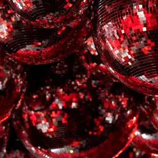 red disco balls hanging from the ceiling