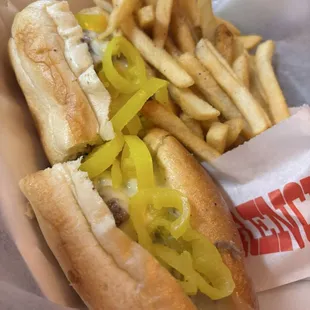 Cheesesteak with mild peppers and house seasoned fries