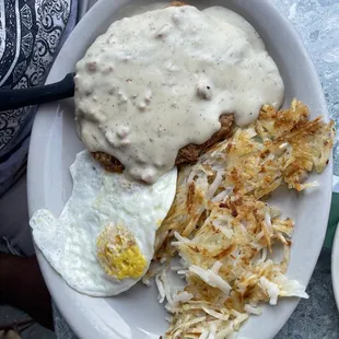 Chicken fried steak with hash browns and over easy egg