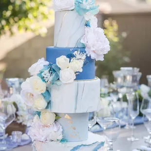 a blue and white wedding cake