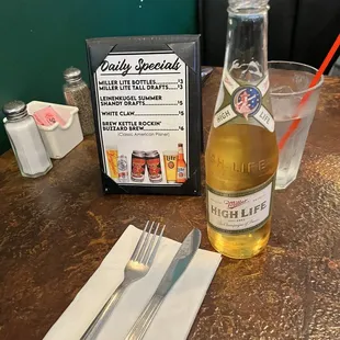 a bottle of beer and a fork