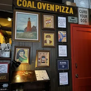 a sign for coal oven pizza